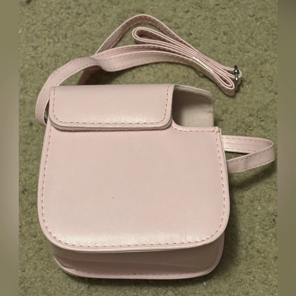 NWOT instax mini 7+ pink camera case with a long strap
